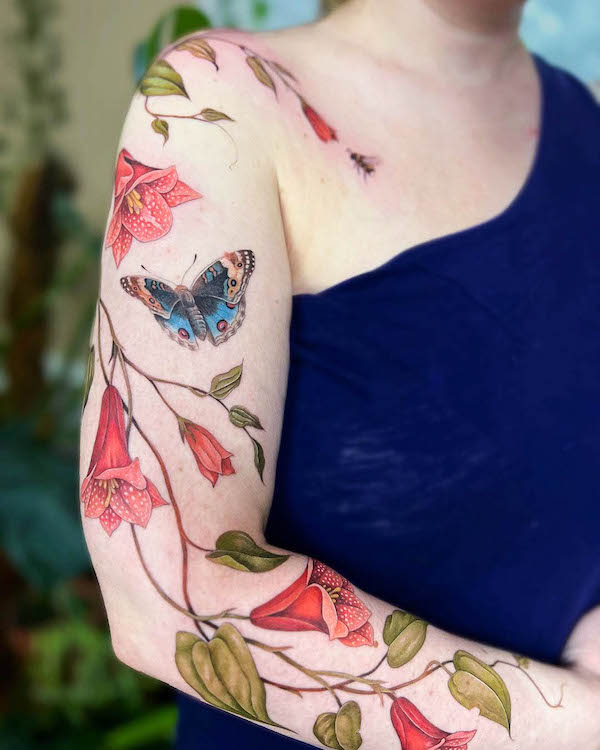 Female Closed Arm Tattoo with Flowers