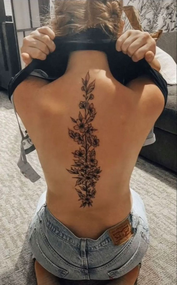 Female tattoo on the back