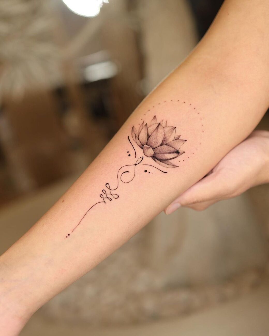 female tattoo on forearm flowers