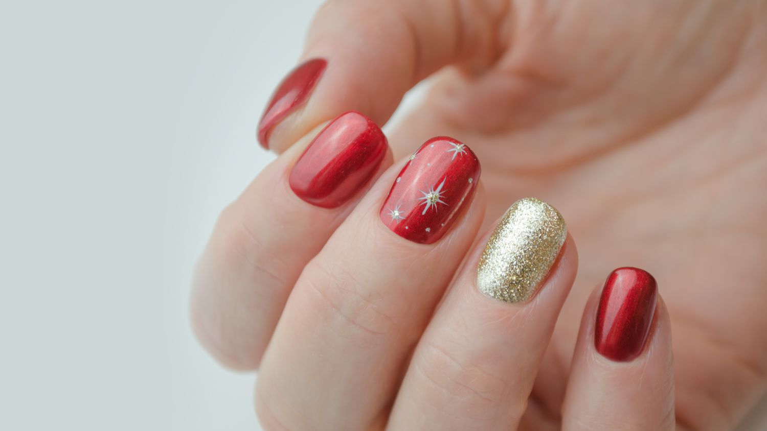 Red And Gold Decorated Nail