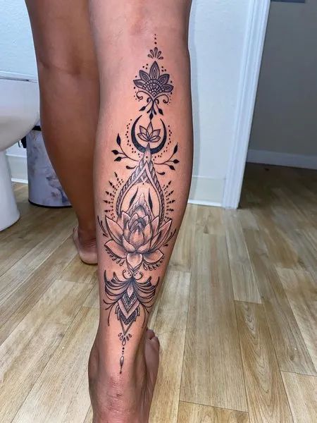 female calf tattoo