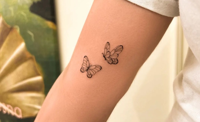 tatuagem feminina no antebraço borboleta