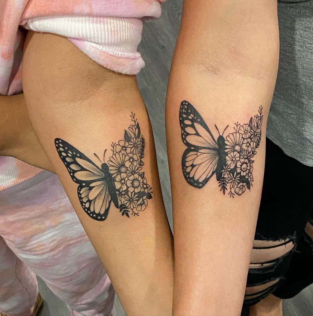 female butterfly tattoo on forearm