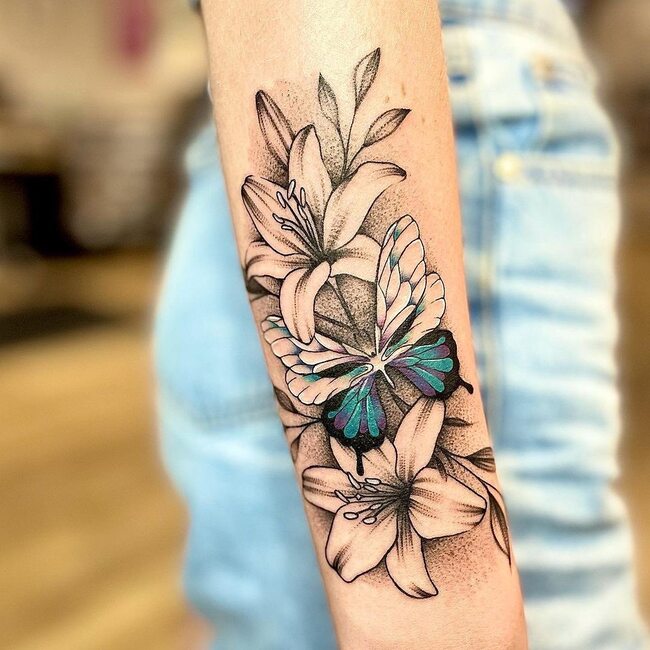 female butterfly tattoo on forearm