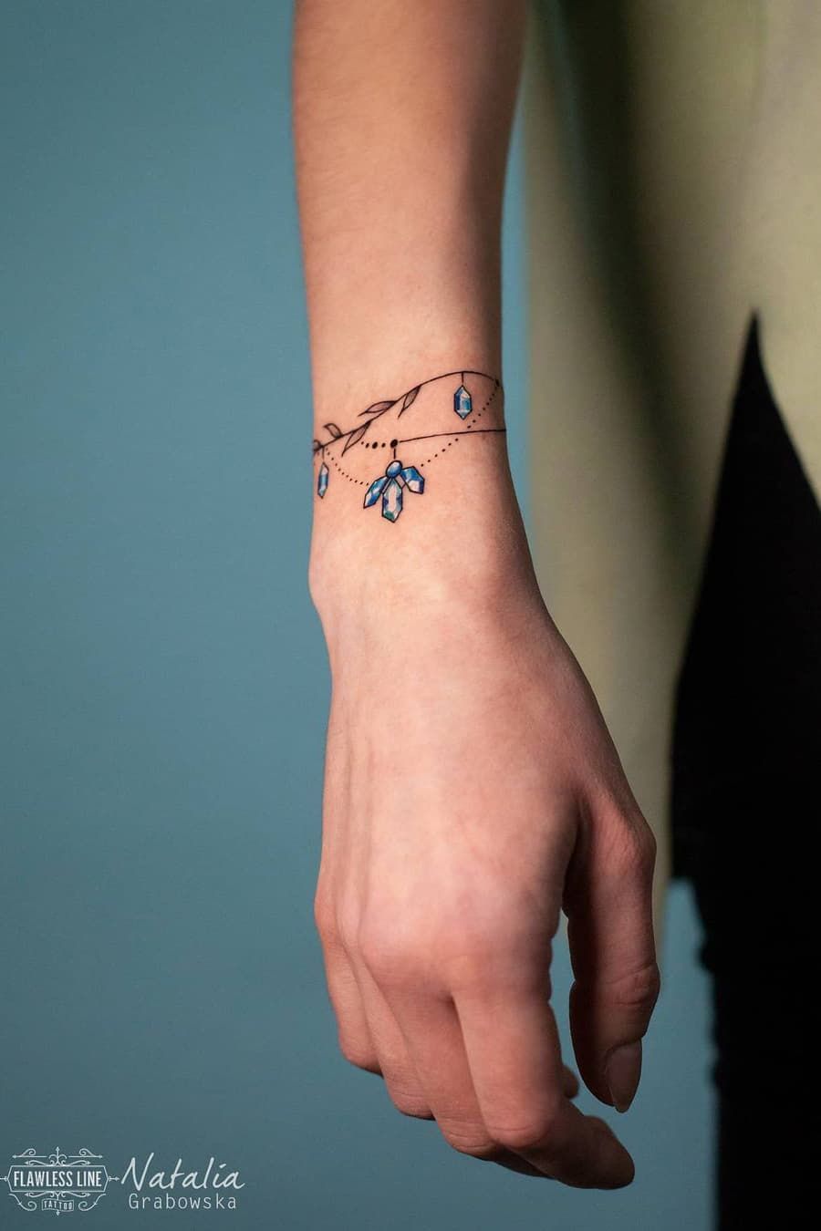 female bracelet tattoo