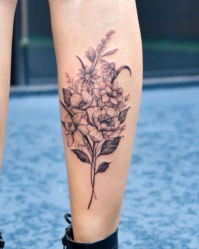 female calf tattoo