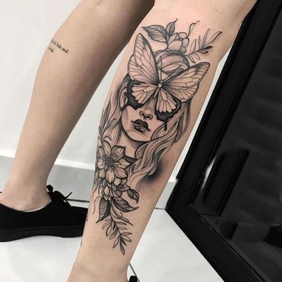 female calf tattoo