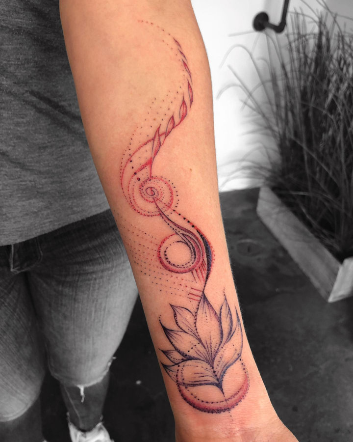 delicate feminine tattoo on forearm