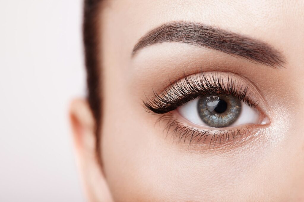 Female eye with long false eyelashes